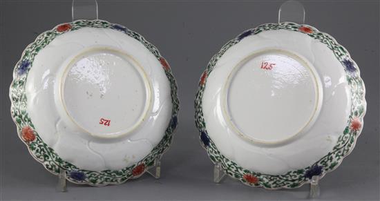 A pair of Chinese famille verte petal moulded saucer dishes, Kangxi period, diameter 16.5cm, slight damage